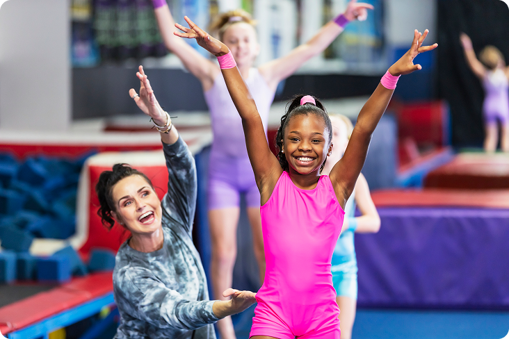 Gymnastics instructor with smiling children